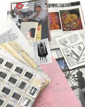 archival materials on a table collaged