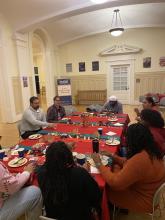 people gathered around table eating