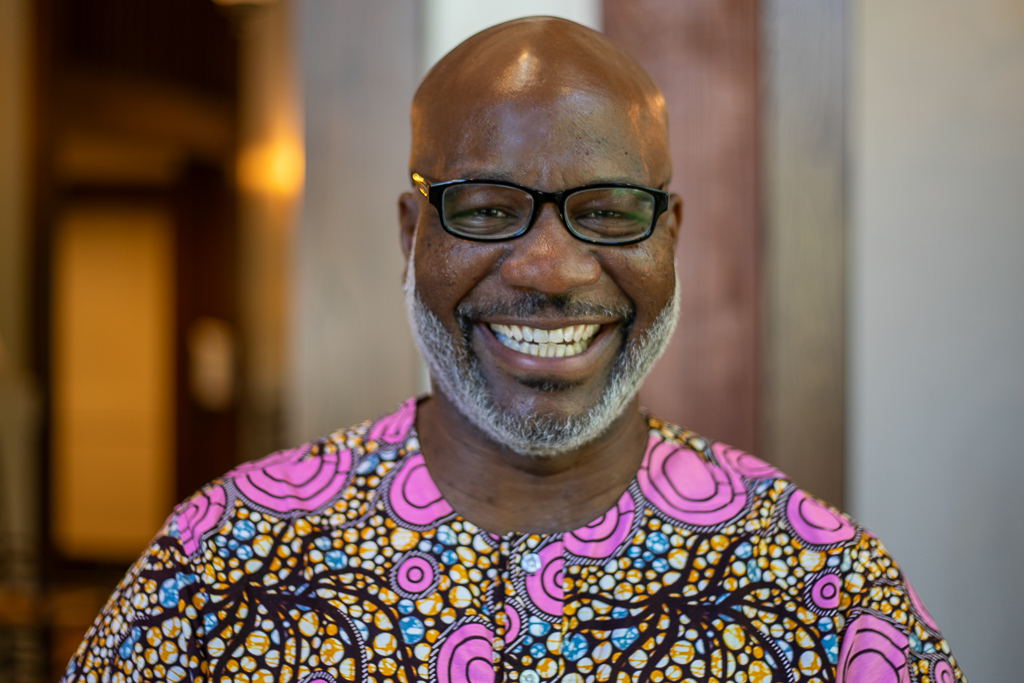 Image of RTV with colorful print shirt, glasses, and beard